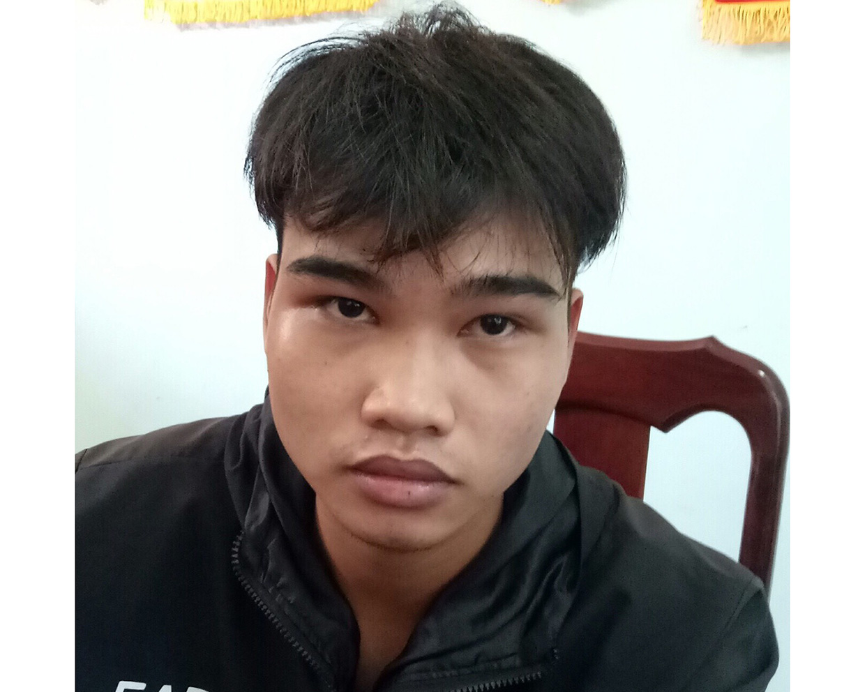 Đối tượng Trần Quốc Doanh tại cơ quan công an. Ảnh: Hoàng Hiền